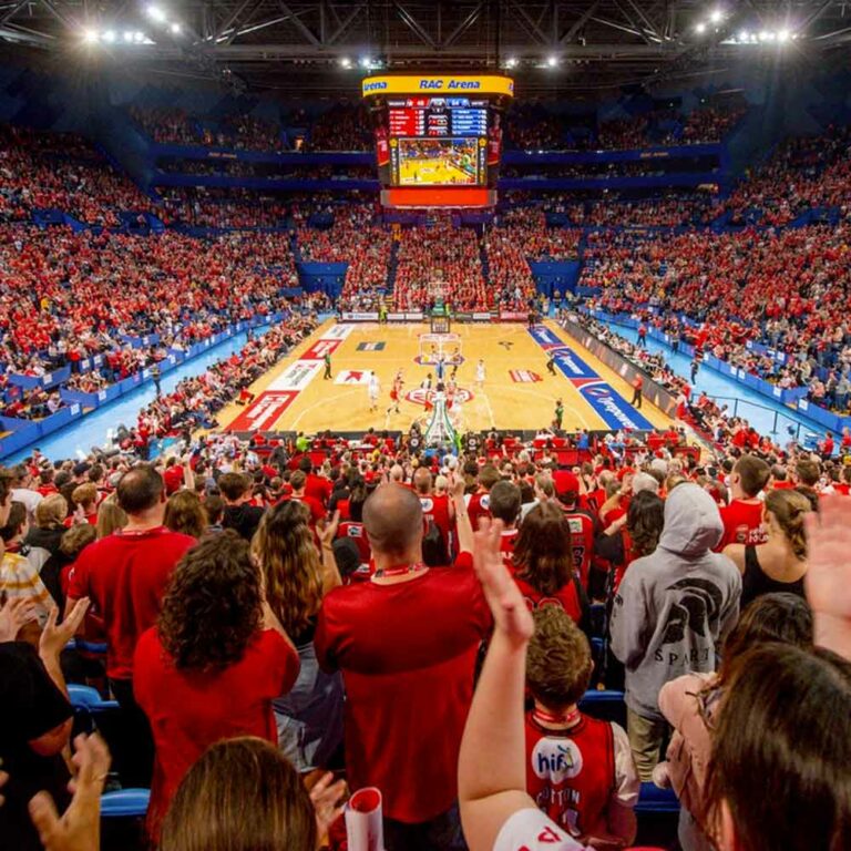 Baskteball game at RAC Arena in Perth with the stadium full of people wearing mainly red t-shirts.